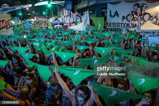 Aerial view showing demonstrators displaying green headscarfs -symbol of pro-abortion activists- outside the Argentine Congress in Buenos Aires, on...