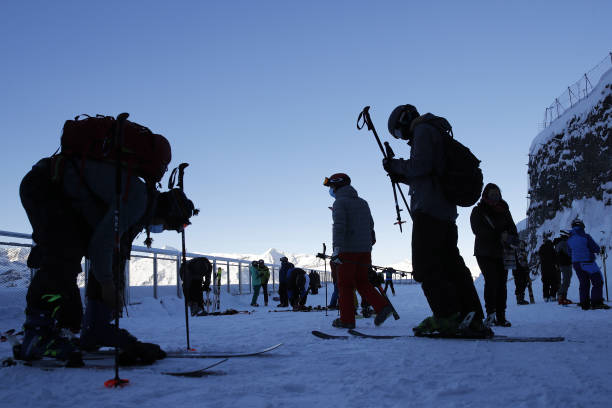 People prepare to ski at the Kleine Scheidegg ski resort in Grindelwald, Switzerland, on Thursday, Dec. 10, 2020. The pandemic has left the lift...