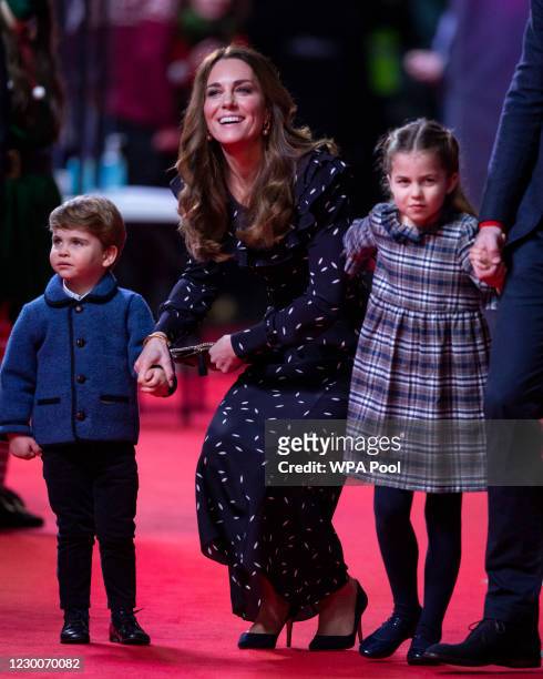 Catherine, Duchess of Cambridge, Prince Louis and Princess Charlotte attend a special pantomime performance at London's Palladium Theatre, hosted by...
