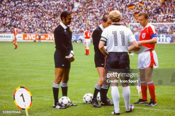 Karl Heinz Rummenigge of Germany, Bob Valentine, referee and Erich Obermayer of Austria during the FIFA World Cup 1982 match between West Germany and...