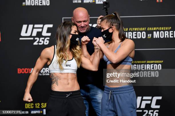 In this handout image provided by UFC, Tecia Torres and Sam Hughes face off during the UFC 256 weigh-in at UFC APEX on December 11, 2020 in Las...