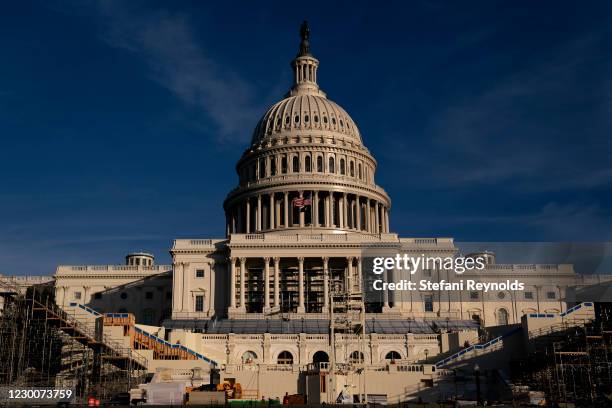 The stage for the Presidential inauguration is prepared outside the U.S. Capitol on December 11, 2020 in Washington, DC. More than 100 Republicans in...