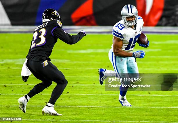 Dallas Cowboys wide receiver Amari Cooper makes a reception against Baltimore Ravens cornerback Anthony Averett during the Dallas Cowboys game versus...