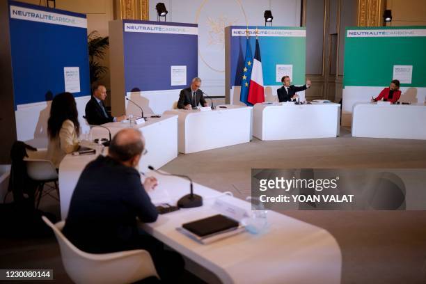 French President Emmanuel Macron speaks during a video conference about climate and carbon neutrality at the Elysee Palace in Paris on December 12...