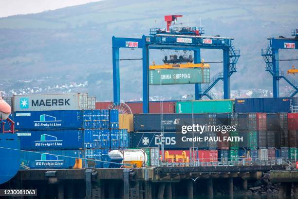 Containers are pictured in the Belfast Harbour and docks area in Northern Ireland on December 11, 2020. - The port is Northern Ireland's main...