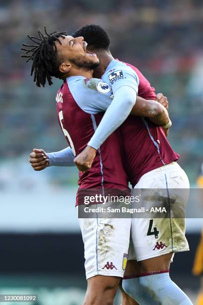 Tyrone Mings of Aston Villa and Ezri Konsa of Aston Villa celebrate at full time during the Premier League match between Wolverhampton Wanderers and...