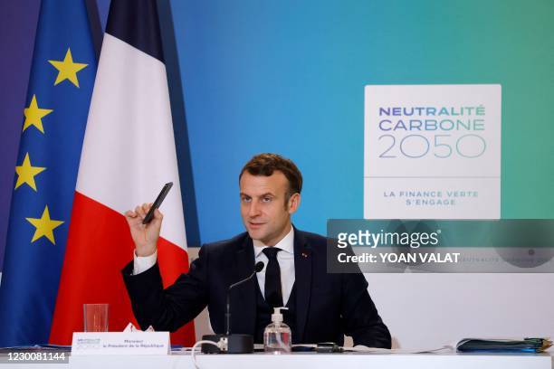 French President Emmanuel Macron speaks during a video conference about climate and carbon neutrality at the Elysee Palace in Paris on December 12...
