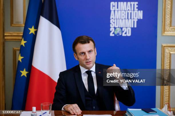 French President Emmanuel Macron gestures as he speaks during the Climate Ambition Summit 2020 video conference meeting at the Elysee Palace in...