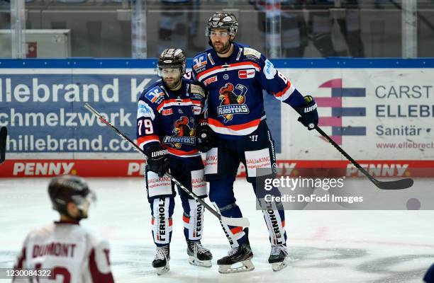 Joe Whitney of Iserlohn Roosters and Alexandre Grenier of Iserlohn Roosters celebrates after scoring his teams second goal with teammates during the...