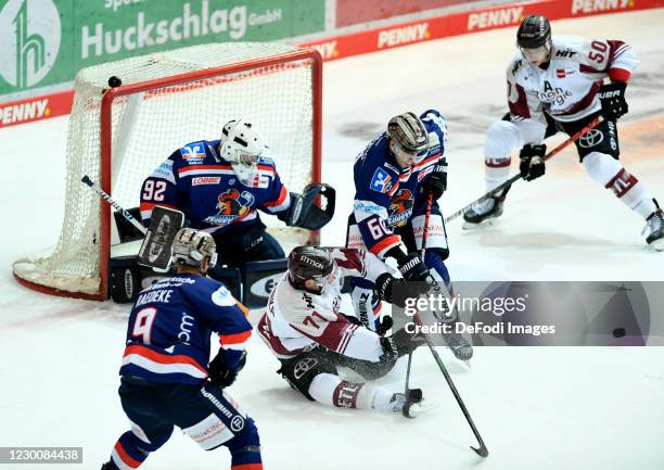 Marcel Barinka of Koelner Haie and Philip Riefers of Iserlohn Roosters battle for the puck during the Ice Hockey Test Match between Iserlohn Roosters...