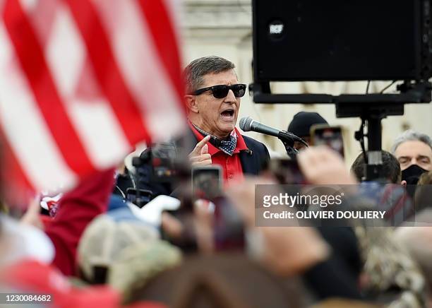 Former US National Security Advisor Michael Flynn speaks to supporters of US President Donald Trump during the Million MAGA March to protest the...