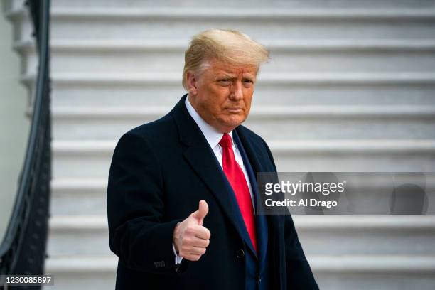 President Donald Trump gives a thumbs up as he departs on the South Lawn of the White House, on December 12, 2020 in Washington, DC. Trump is...