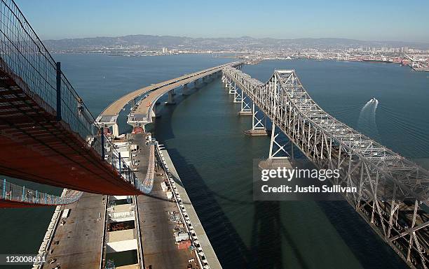 Catwalks hang over a section of the newly constructed eastern span of the San Francisco-Oakland Bay Bridge during a media tour of the self-anchored...