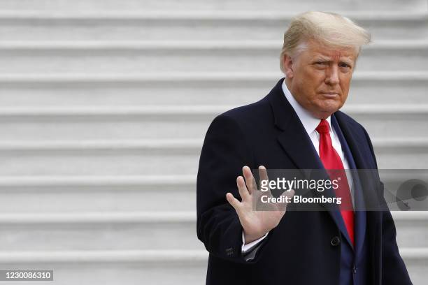 President Donald Trump waves to members of the media before boarding Marine One on the South Lawn of the White House in Washington, D.C., U.S., on...