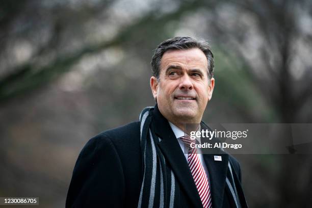 Director of National Intelligence John Ratcliffe follows behind U.S. President Donald Trump, as they depart on the South Lawn of the White House, on...