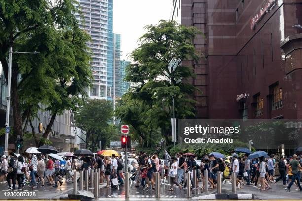 Crowds, in the hundreds, thronged Singapore's shopping belt in preparation for the festive season despite the coronavirus pandemic which has recorded...