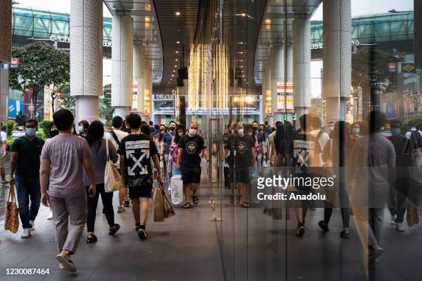 Crowds, in the hundreds, thronged Singapore's shopping belt in preparation for the festive season despite the coronavirus pandemic which has recorded...