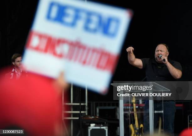 Far-right radio show Alex Jones speaks to supporters of US President Donald Trump as they demonstrate in Washington, DC, on December 12 to protest...