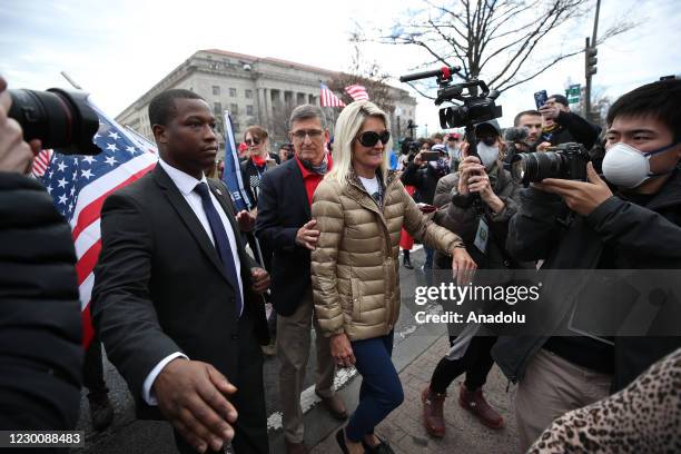 Former United States National Security Advisor Michael Flynn and his wife Lori Andrade are seen as Pro-Trump protesters and Proud Boys gathered...