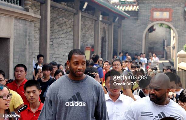 American professional basketball player Tracy McGrady of the Detroit Pistons visits the Foshan Ancestral Temple on August 29, 2011 in Foshan,...