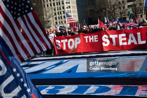 Demonstrators hold a "Stop The Steal" banner in Freedom Plaza during the "Million MAGA March" in Washington, D.C., U.S., on Saturday, Dec. 12, 2020....