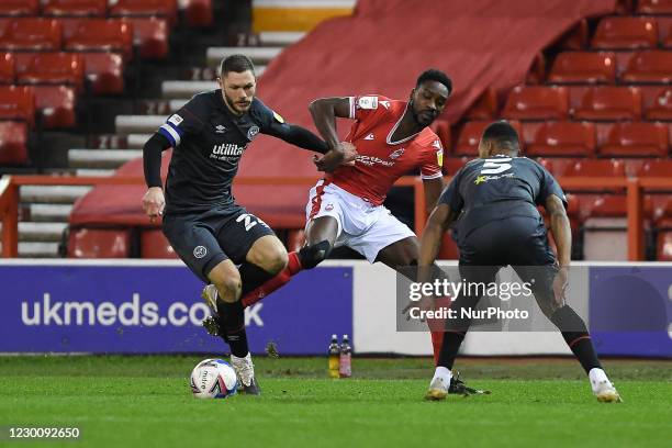 Henrik Dalsgaard of Brentford battles with Sammy Ameobi of Nottingham Forest during the Sky Bet Championship match between Nottingham Forest and...