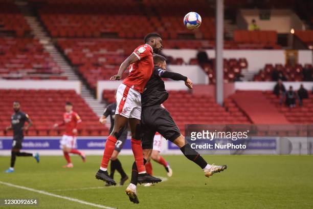 Sammy Ameobi of Nottingham Forest wins the ball from Henrik Dalsgaard of Brentford during the Sky Bet Championship match between Nottingham Forest...