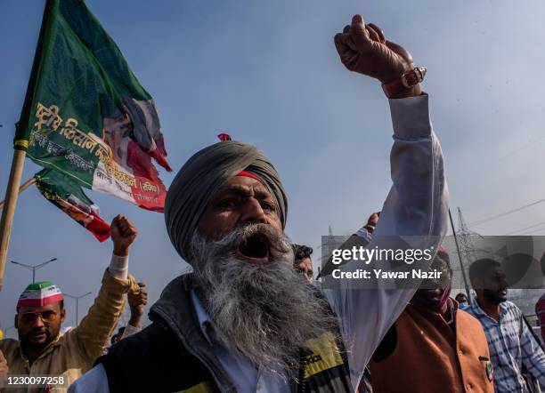 An elderly Indian farmer shouts anti government slogans during a protest against new farm laws on December 13, 2020 at the Delhi-Uttar Pradesh border...