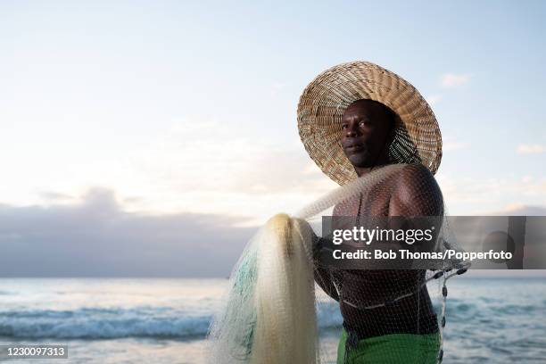 Local fisherman Roderick Clarke fishing in the Caribbean Sea at Brighton beach on the West coast of, Barbados, 19th November 2018.