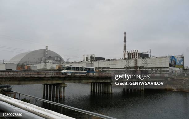 This photograph taken on December 8, 2020 shows a general view of Chernobyl nuclear power plant and giant protective dome built over the sarcophagus...