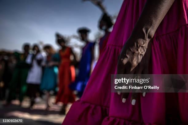 Model wears a creation by Senegalese designer and Dakar Fashion Week organiser Adama Paris backstage during an outdoor show on December 12, 2020 just...