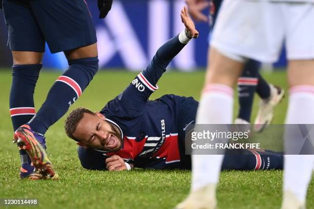 Paris Saint-Germain's Brazilian forward Neymar reacts after getting injured during the French L1 football match between Paris Saint-Germain and Lyon...