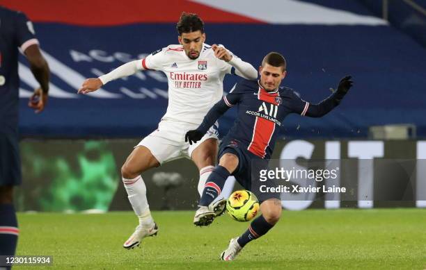 Lucas Paqueta of Olympique Lyon in action with Marco Verratti of PSG during the Ligue 1 match between Paris Saint-Germain and Olympique Lyon at Parc...