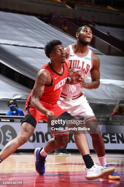 Kenny Wooten of the Houston Rockets fights for position against Cristiano Felicio of the Chicago Bulls during a preseason game at the United Center...