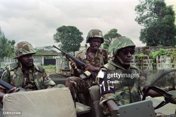 Picture taken on October 26, 1992 in the outskirts of Monrovia showing ECOMOG soldiers patrolling the area under the siege of the Charles Taylor's...