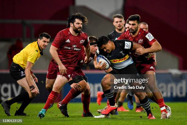 Limerick , Ireland - 13 December 2020; Ben Tapuai of Harlequins is tackled by Damian de Allende of Munster during the Heineken Champions Cup Pool B...