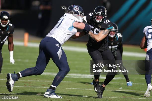 Jacksonville Jaguars Defensive End Aaron Lynch battles Tennessee Titans Offensive Tackle Dennis Kelly during the game between the Tennessee Titans...