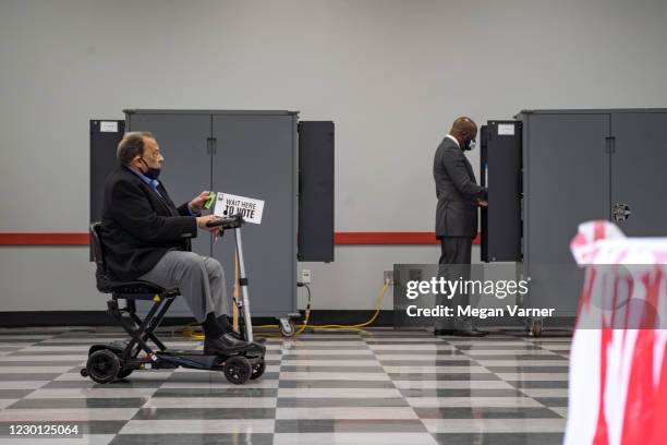 Democratic nominee for U.S. Senate Rev. Raphael Warnock and former Atlanta mayor and U.N. Ambassador Andrew Young cast their votes in the runoff...