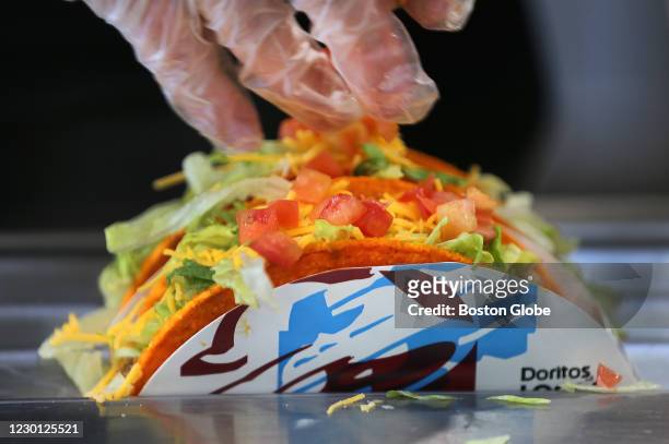 Doritos tacos are made at the new Taco Bell Cantina in Brookline, MA on Dec. 4, 2020. The new Taco Bell on Boston University's campus on Commonwealth...