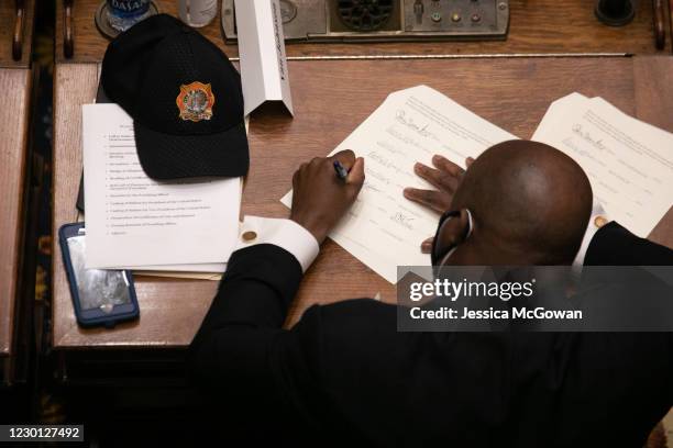 Savannah mayor Van Johnson signs a Certificate of Vote during the meeting of Georgia Democratic Electors to cast their Electoral College votes at the...