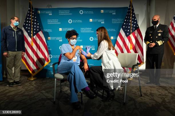 Health and Human Services Secretary Alex Azar and U.S. Surgeon General Dr. Jerome Adams watch as Dr. Sheetal Sheth, center left, OB-GYN and Medical...