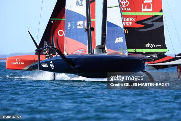 Emirates Team New Zealand and American Magic compete on practice racing day five of the 36th America's Cup yacht race in Auckland on December 15,...