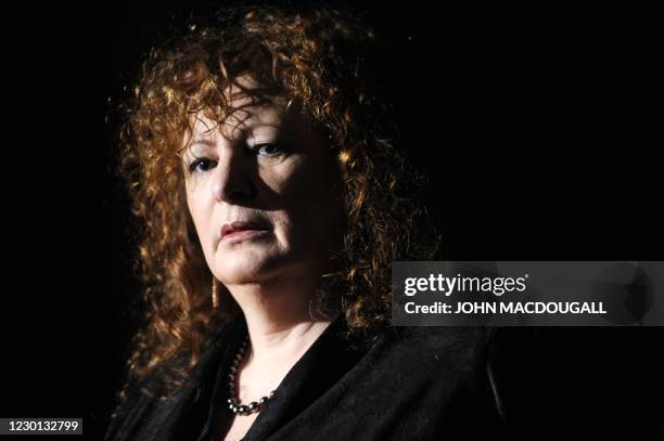 Photographer Nan Goldin addresses a press conference during the presentation to the press of her exhibition "Poste Restante, Slideshows/Grids" in...