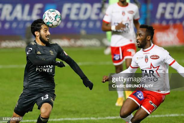 S Mousa Tamari and Mouscron's Fabrice Olinga fight for the ball during a soccer match between RE Mouscron and Oud-Heverlee Leuven, Tuesday 15...