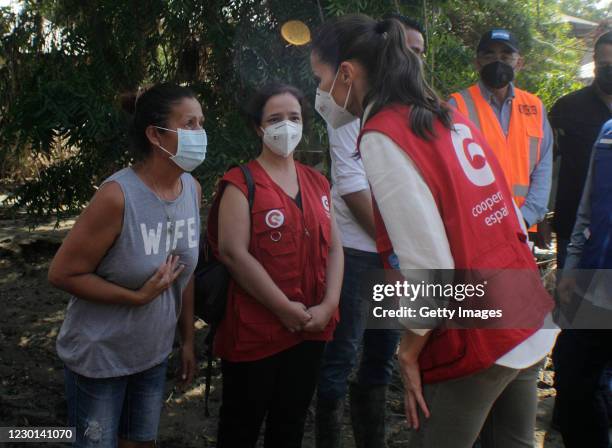Queen Letizia of Spain listens to a victim of the recent hurricanes that struck the area during an Official Visit to Honduras on December 15, 2020 in...