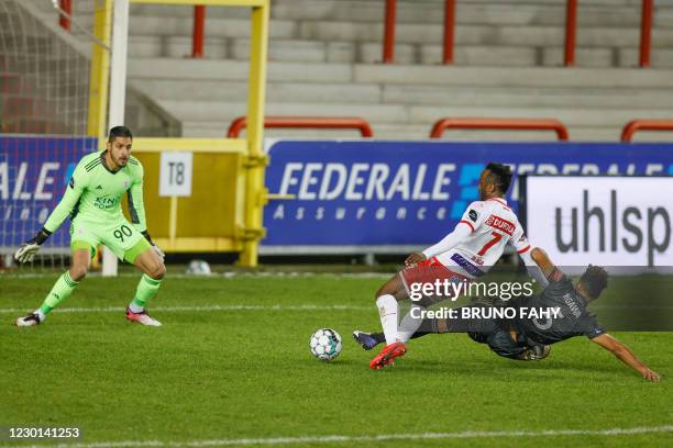S goalkeeper Rafael Romo, Mouscron's Fabrice Olinga and OHL's Pierre Yves Ngawa fight for the ball during a soccer match between RE Mouscron and...