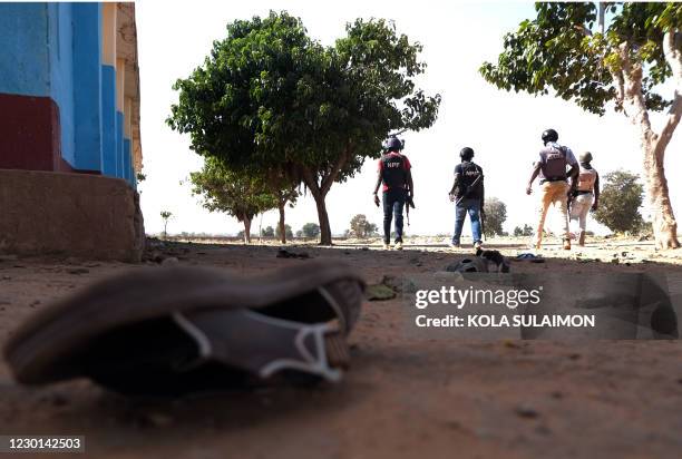 Police patrol inside the Government Science school in Kankara, in northwestern Katsina state, Nigeria after gunmen abducted students on December 15,...