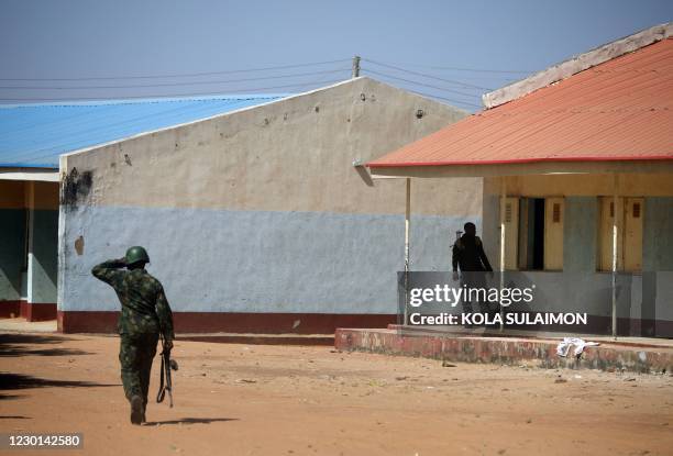 NIgerian soldiers walk inside the Government Science where gunmen abducted students in Kankara, in northwestern Katsina state, Nigeria December 15,...