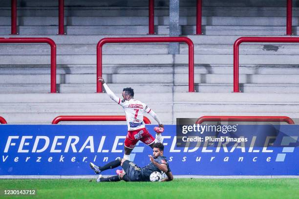 Pierre-Yves Ngawa of OH Leuven battles for possession with Fabrice Olinga of Royal Excel Mouscron during the Jupiler Pro League match between Royal...
