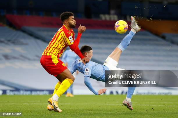 Manchester City's English midfielder Phil Foden attempts an overhead kick during the English Premier League football match between Manchester City...